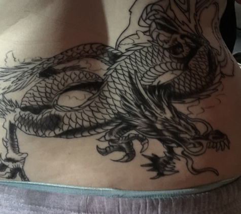 Tattoo Jungle - Calera, AL. My dragon, the lower part of my back piece..done by Jeff.
