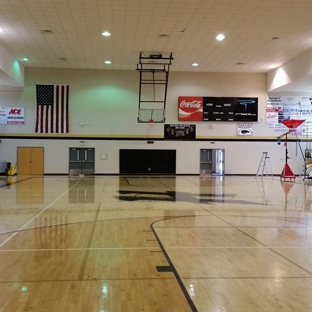 Mount Olive Painting. Hayden High School Gym. Wall painting & black & gold team color striping.