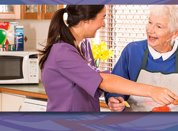 Amana Living - Spencer Park, WA. A resident with her carer preparing food in the kitchen