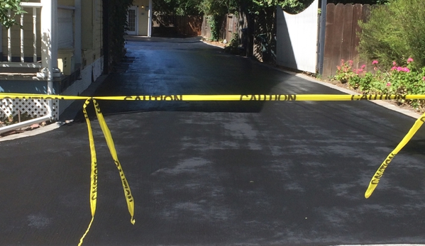 Cato's Paving - Hayward, CA. Driveway after Sealcoat was applied.  The crew taped it off to protect it while drying.