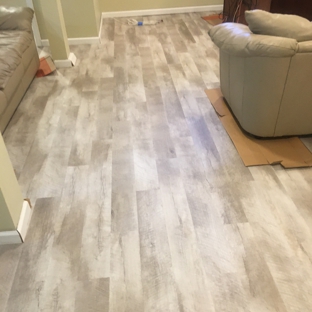 McCauley  Carpet Installations LLC - Manchester, CT. Luxury Vinyl Plank for a finished basement
