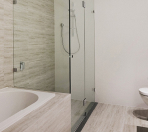 Bradnam's Windows & Doors - Ashmore, QLD. Frameless Shower Screen Next To A Bath