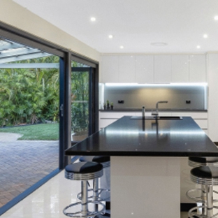 Bradnam's Windows & Doors - Mount St John, QLD. Black Aluminium Bi-Fold Doors