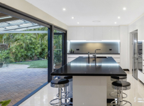 Bradnam's Windows & Doors - Ashmore, QLD. Black Aluminium Bi-Fold Doors